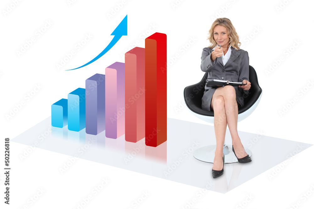 Businesswoman sitting by bar chart Businesswoman sitting by bar chart