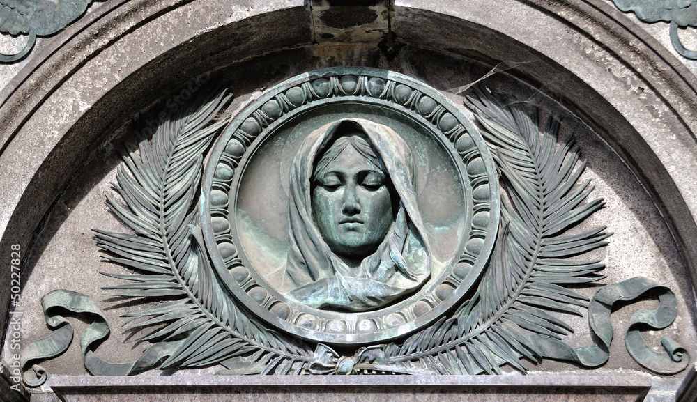 Holy Mary statue on the monument in the cemetery Vysehrad Prague