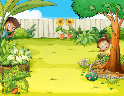A boy and a girl hiding in the garden