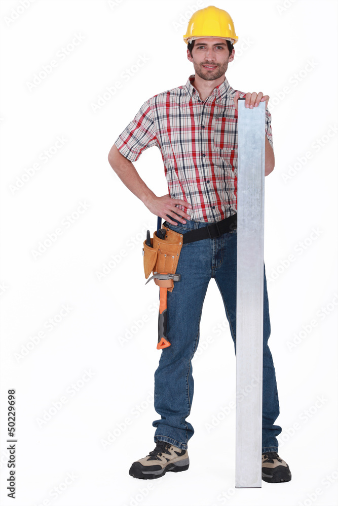A carpenter with a plank. A carpenter with a plank.