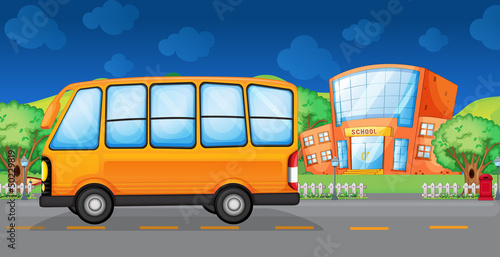 A yellow bus along the street