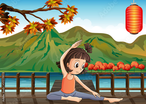 A girl exercising at the bridge with a lantern