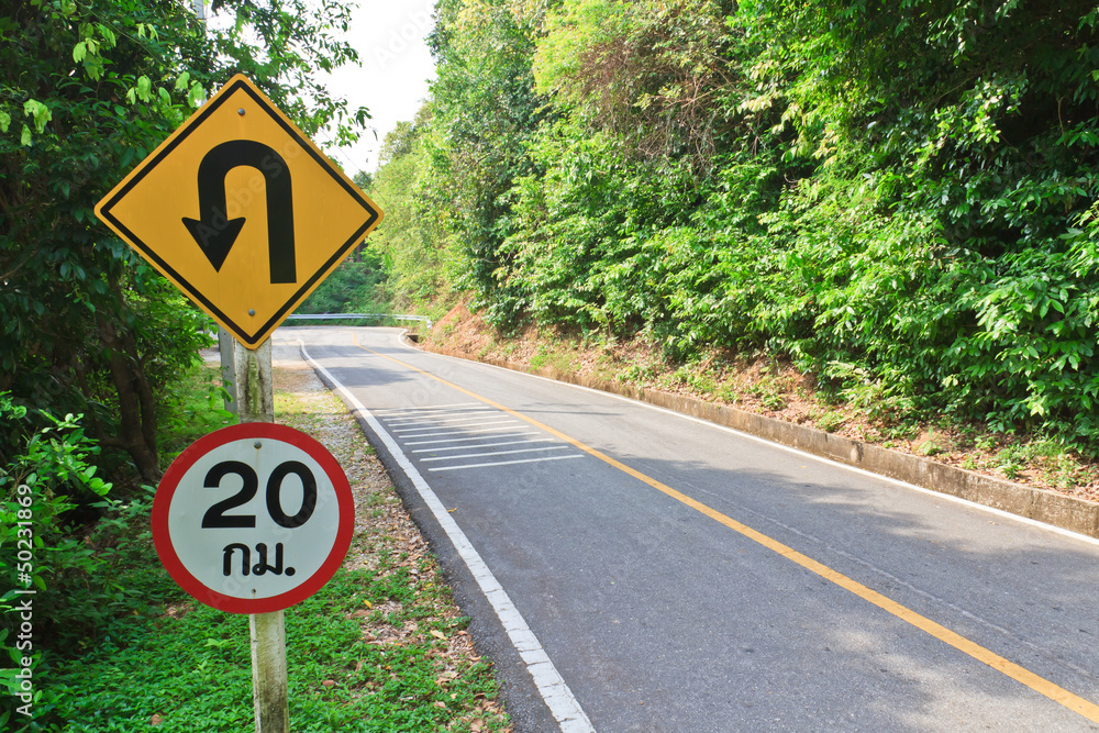 U-turn symbol Road in rustic city in Thailand U-turn symbol Road in rustic city in Thailand