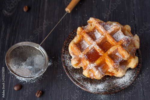 Slika na platnu Waffles with honey and powdered sugar