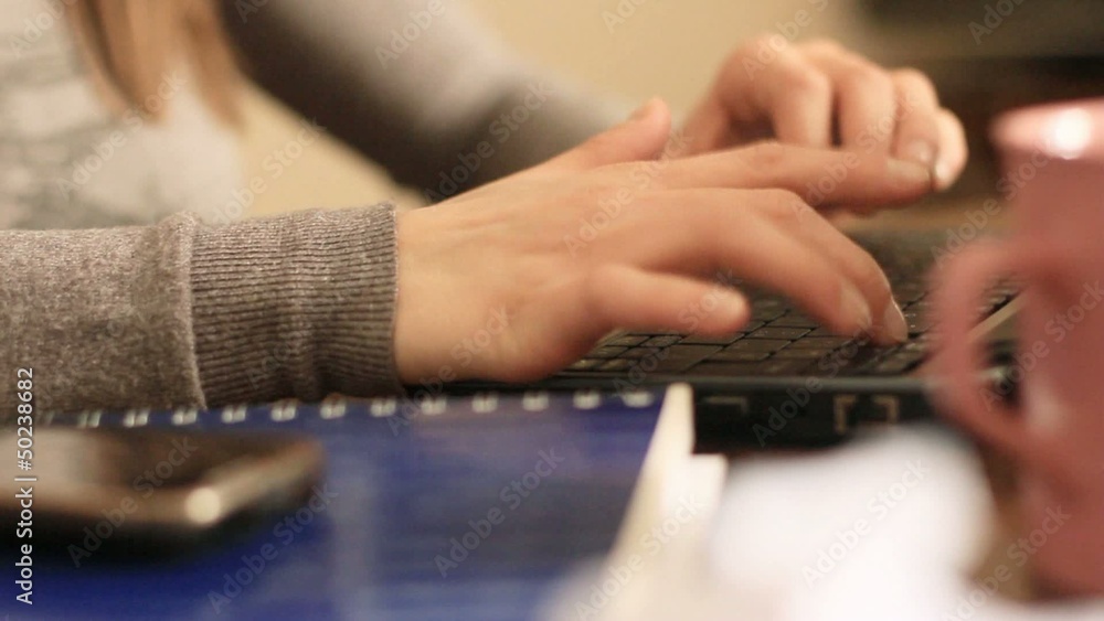 HANDS TYPING ON KEYBOARD