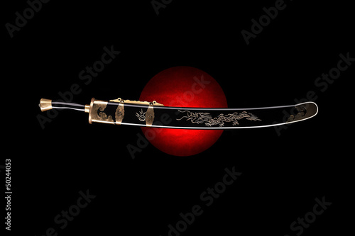 Traditional kung fu sword in scabbard on the black background.