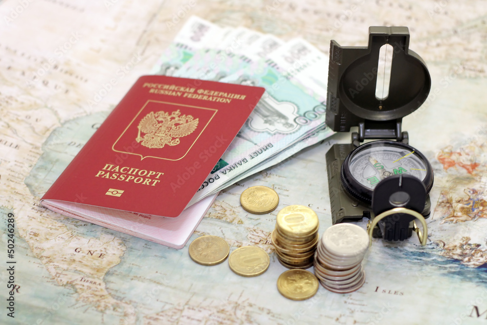 Passport, money and compass. background of the map of the world Passport, money and compass. background of the map of the world