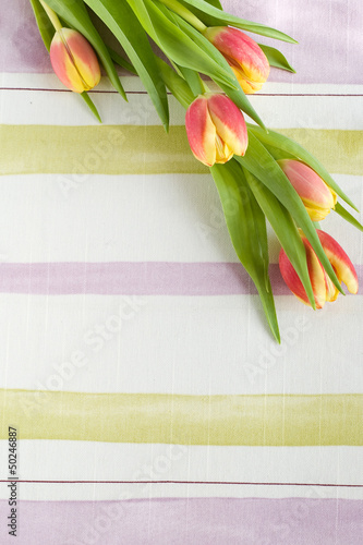 Fototapeta Naklejka Na Ścianę i Meble -  bouquet of tulips on textille serviette