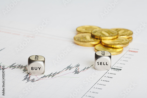 Financial chart, coins and dices cubes with words SELL BUY. Succ