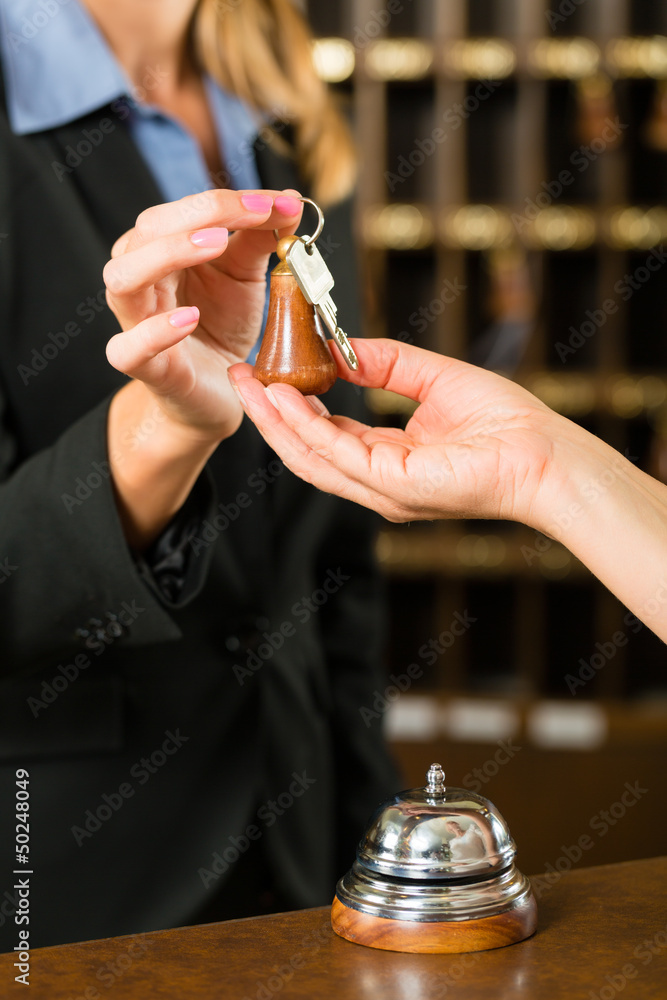 Reception - Guest checking in a hotel - obrazy, fototapety, plakaty 
