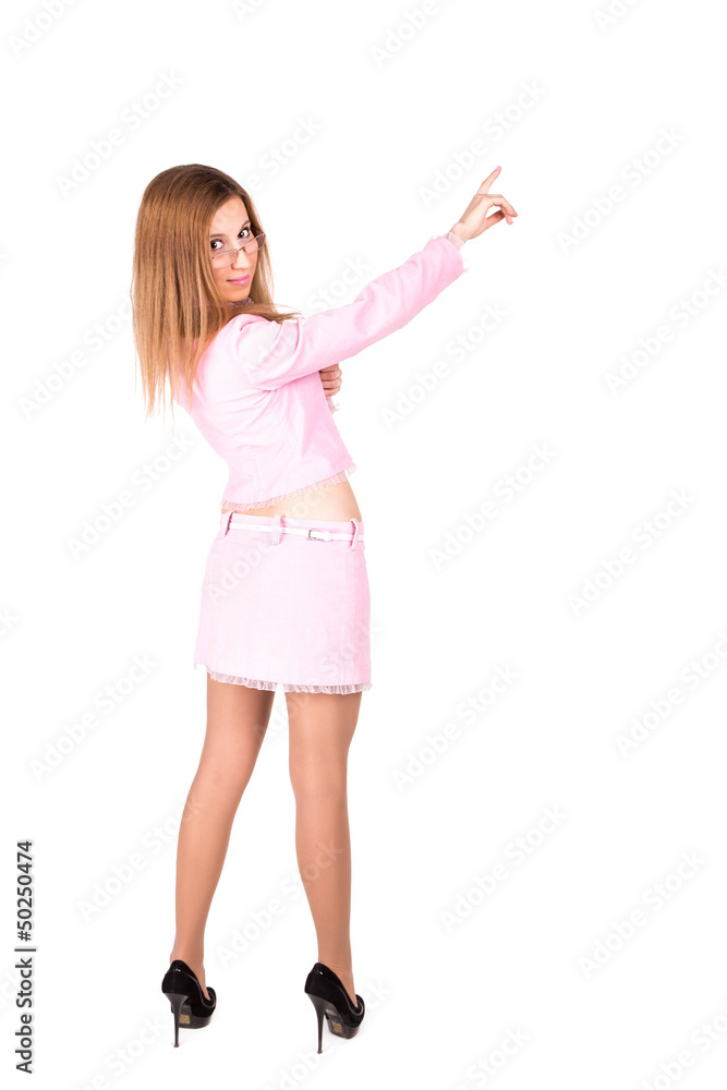 Beautiful business girl in a pink suit poingint out something Beautiful business girl in a pink suit poingint out something