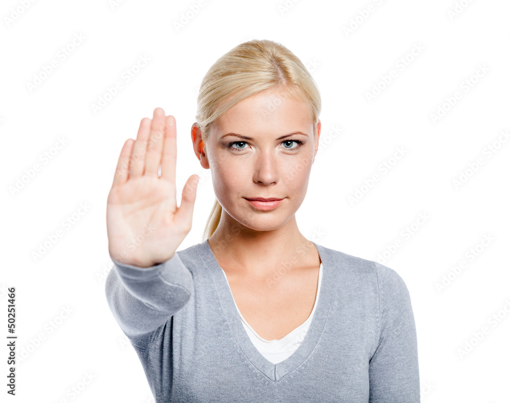 Lady making stop gesture with her palm, isolated on white Lady making stop gesture with her palm, isolated on white