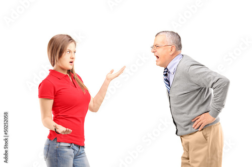 Angry mature man shouting at a young female