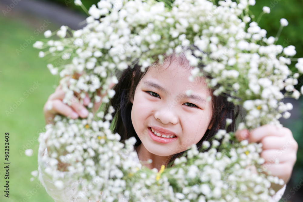 Cute little girl showing a flower tiara Cute little girl showing a flower tiara