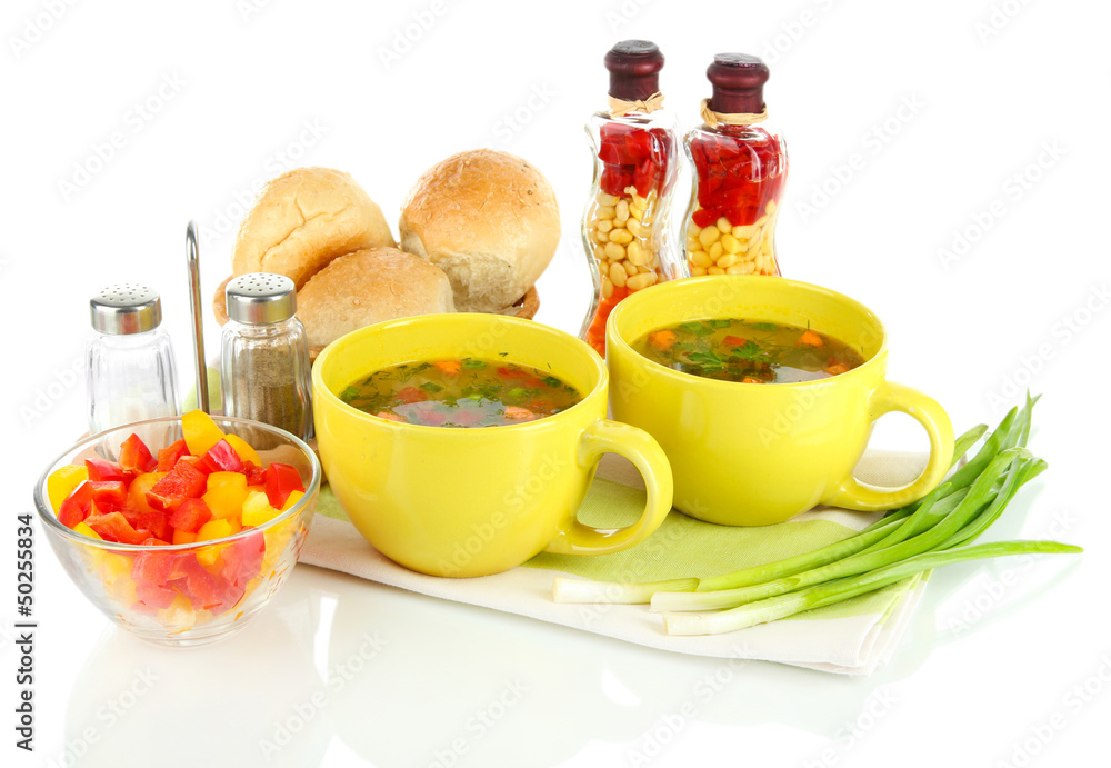 Fragrant soup in cups isolated on white Fragrant soup in cups isolated on white