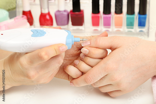 Manicure process in beauty salon  close up