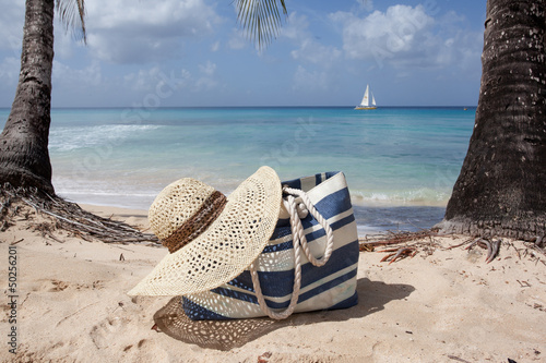 beach hat and bag on the sand