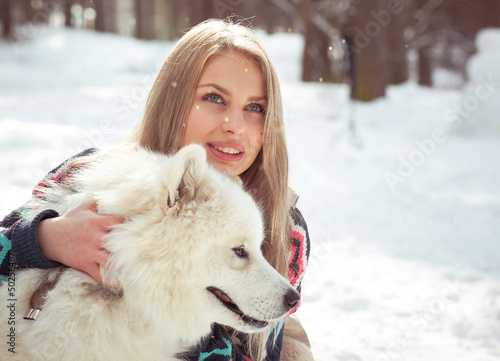 girl with samoed dog