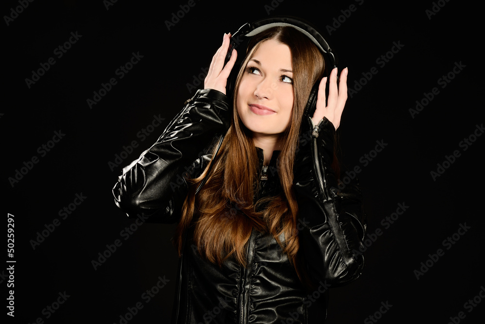 Young woman with big headphones enjoying good music Young woman with big headphones enjoying good music