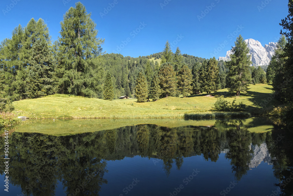 Odle reflected in the lake, Italy