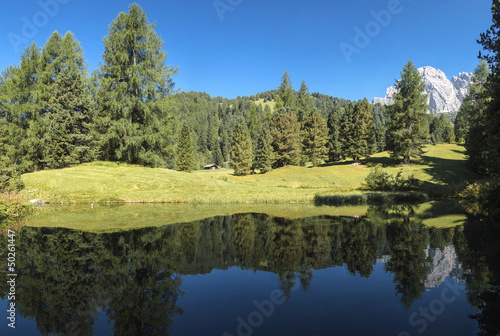 Odle reflected in the lake, Italy