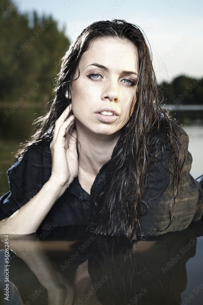 Nice lady in lake water with wet hair style Nice lady in lake water with wet hair style