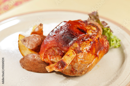 roasted pork knuckle with potatoes