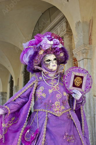 Venetian costume attends Carnival of Venice. © Lovrencg