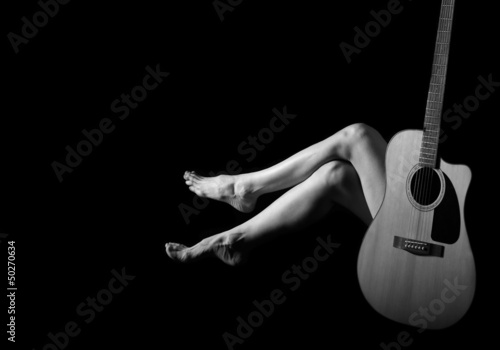 Classic Black and White Art of Woman's body with Guitar