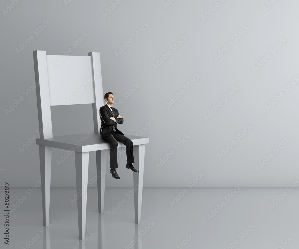 Fototapeta premium man sitting a big chair