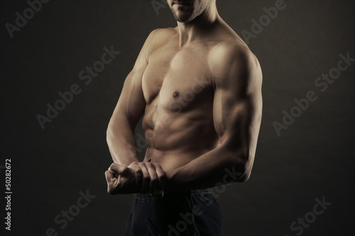 Body builder flexing biceps