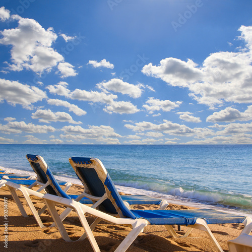 Beach chairs on beach photo