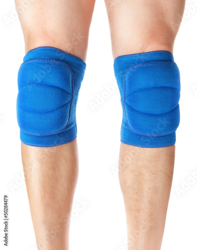 Knee pads to protect the games on male legs. On a white backgrou
