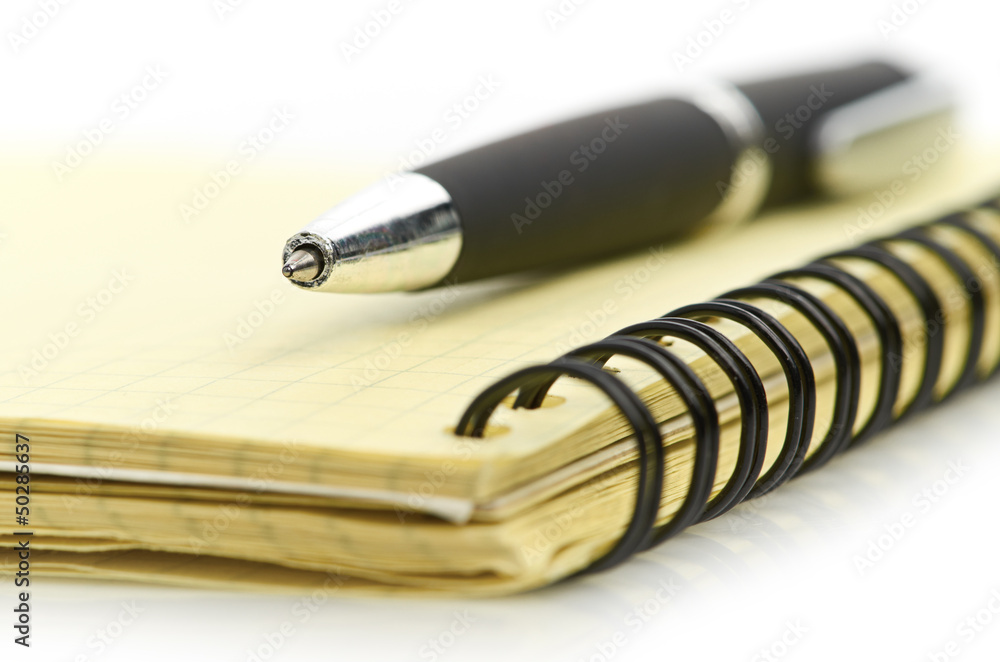 notepad and pen isolated on white background notepad and pen isolated on white background