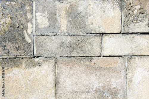 Closeup of decaying limestone wall