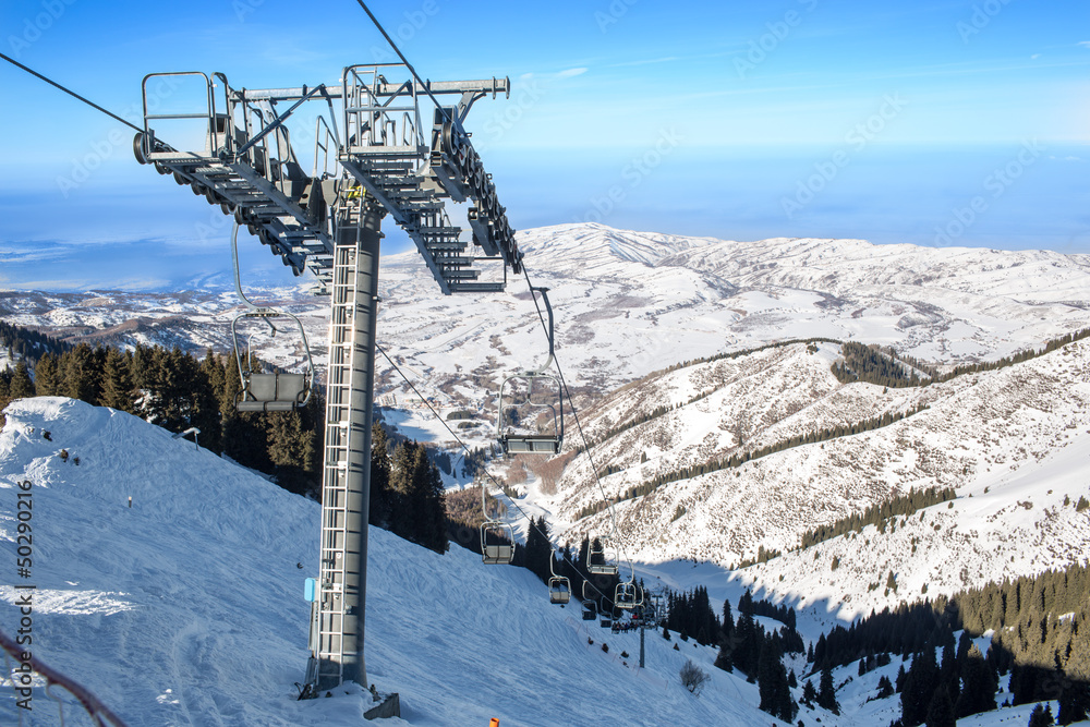 chairlift in mountains in winter in Almaty, Kazakhstan