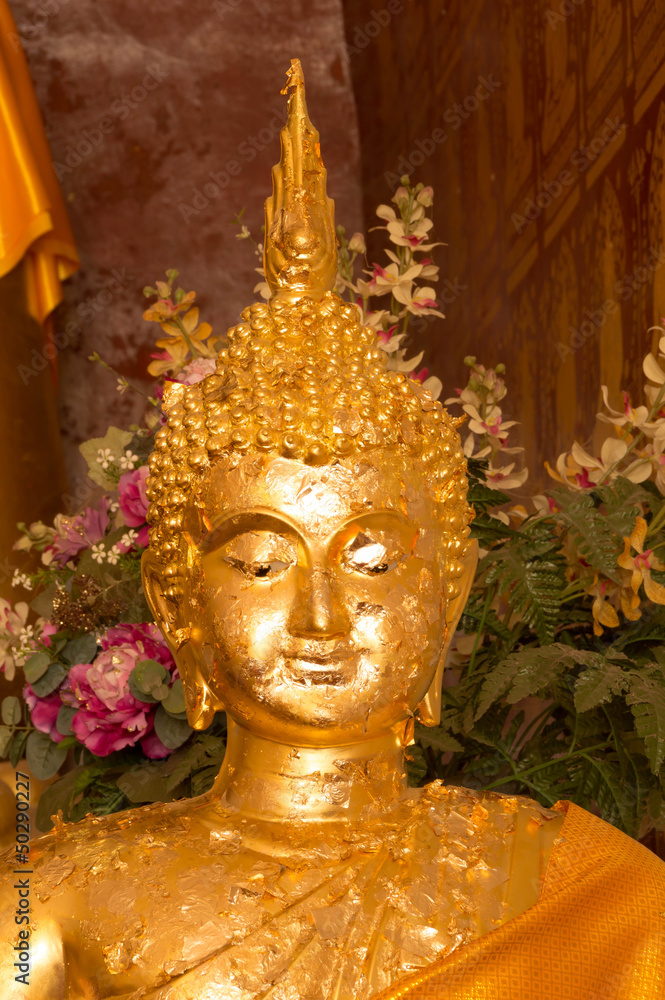 Golden Buddha image in church of Buddhist temple in Thailand