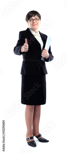 Mature adult businesswoman in a black suit showing ok sign