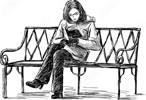 girl reading the book on a bench