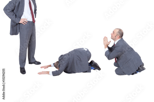 businessmen begging his boss photo