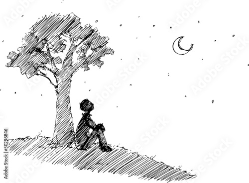 Man looking at the moon under a the tree