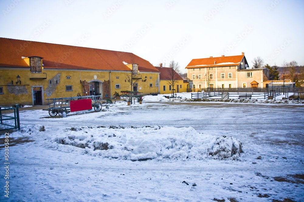 Fototapeta premium Beautiful house in snowy scenery in polish village