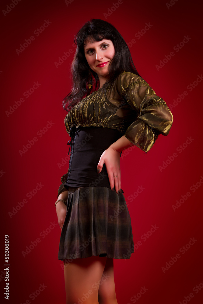 young brunette in an elegant dress young brunette in an elegant dress