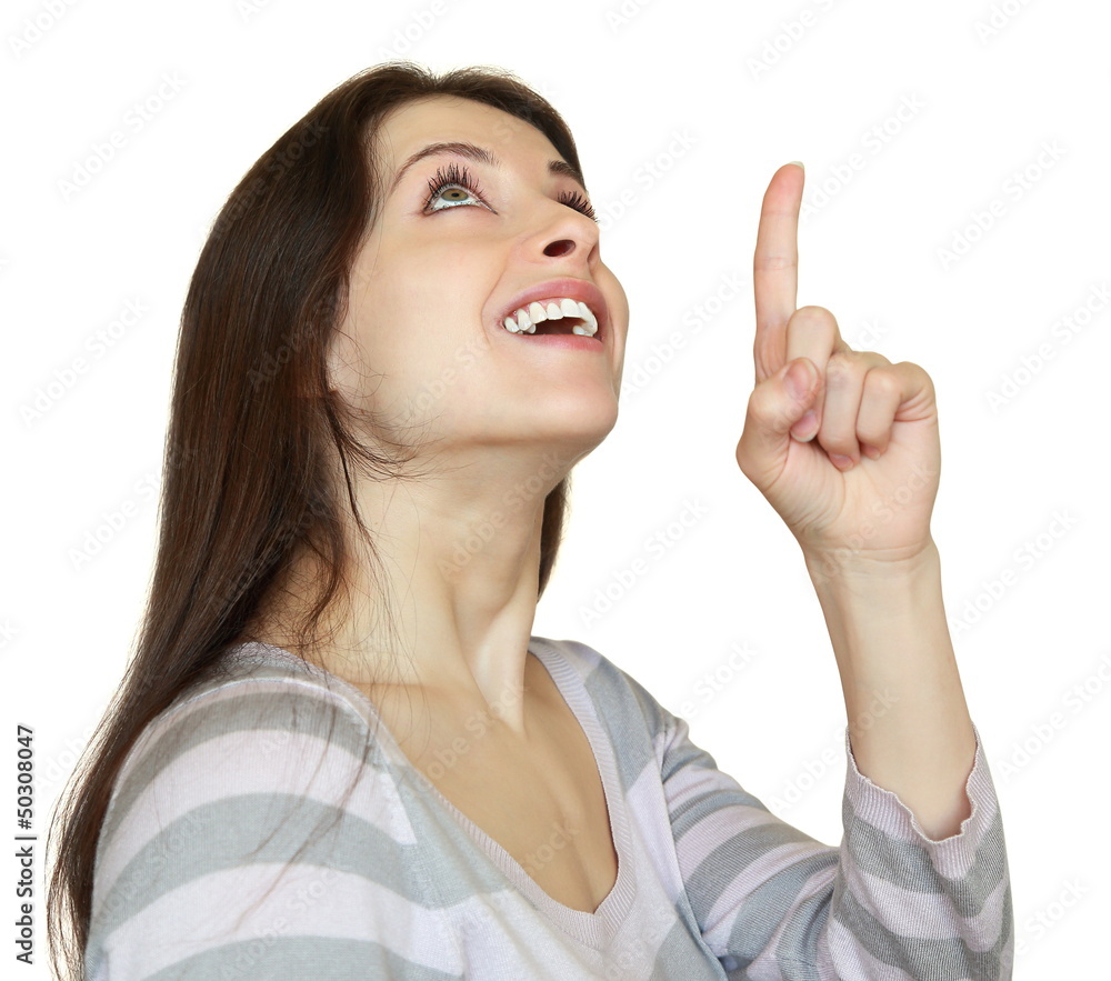 Happy smiling woman showing finger copy space above and looking Happy smiling woman showing finger copy space above and looking