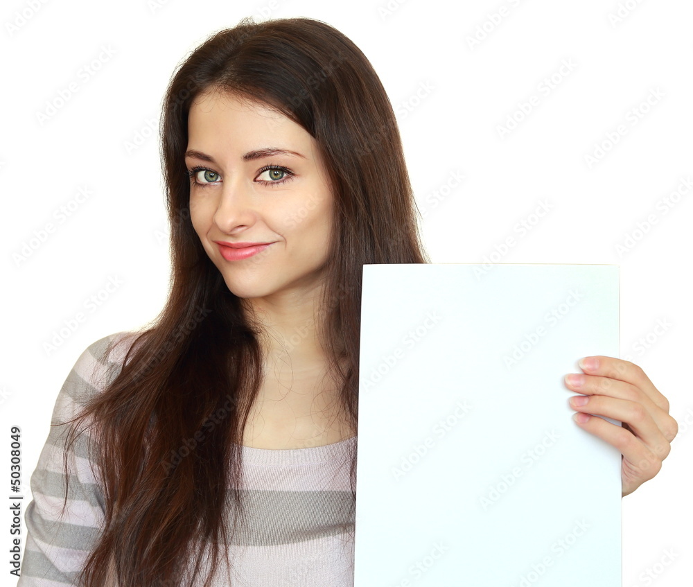 Smiling girl showing empty blank and looking calm isolated on wh Smiling girl showing empty blank and looking calm isolated on wh
