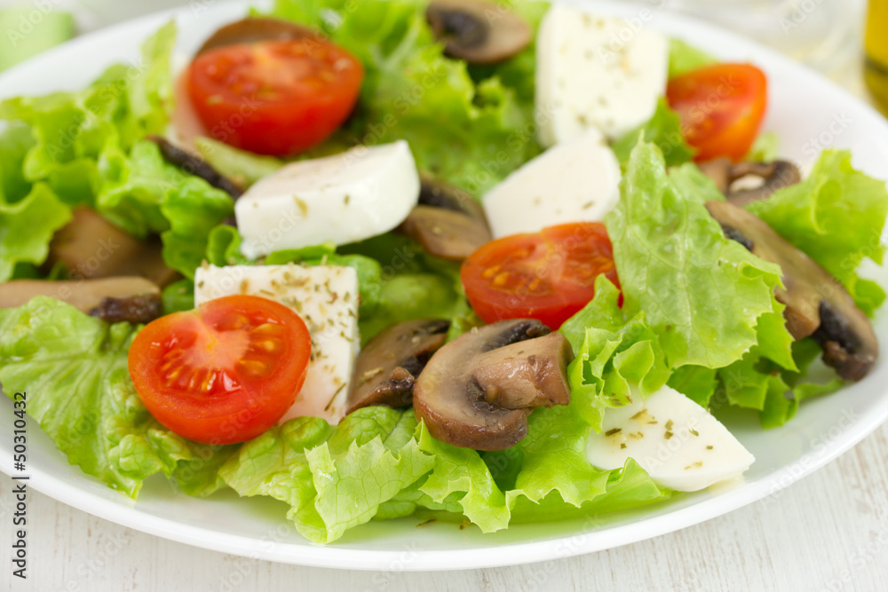 salad with fried portobello, cheese and tomato