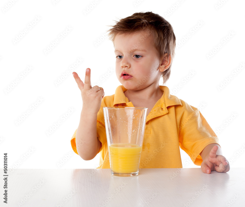 Portrait of happy little boy drinking orange juice. Isolated Portrait of happy little boy drinking orange juice. Isolated