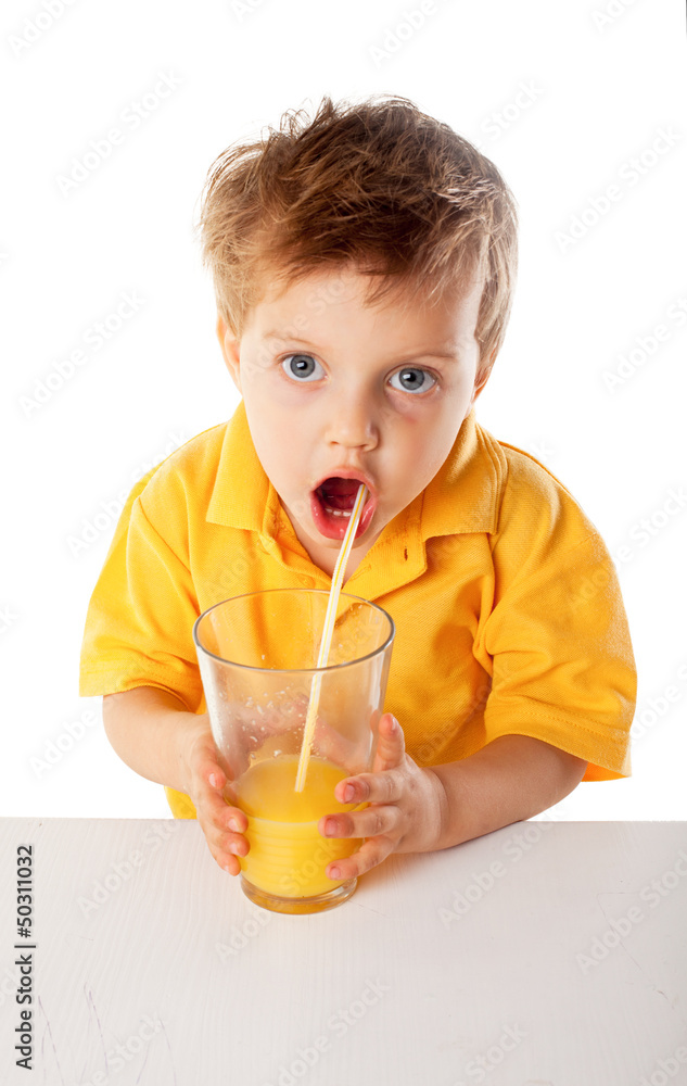 Portrait of happy little boy drinking orange juice. Isolated Portrait of happy little boy drinking orange juice. Isolated