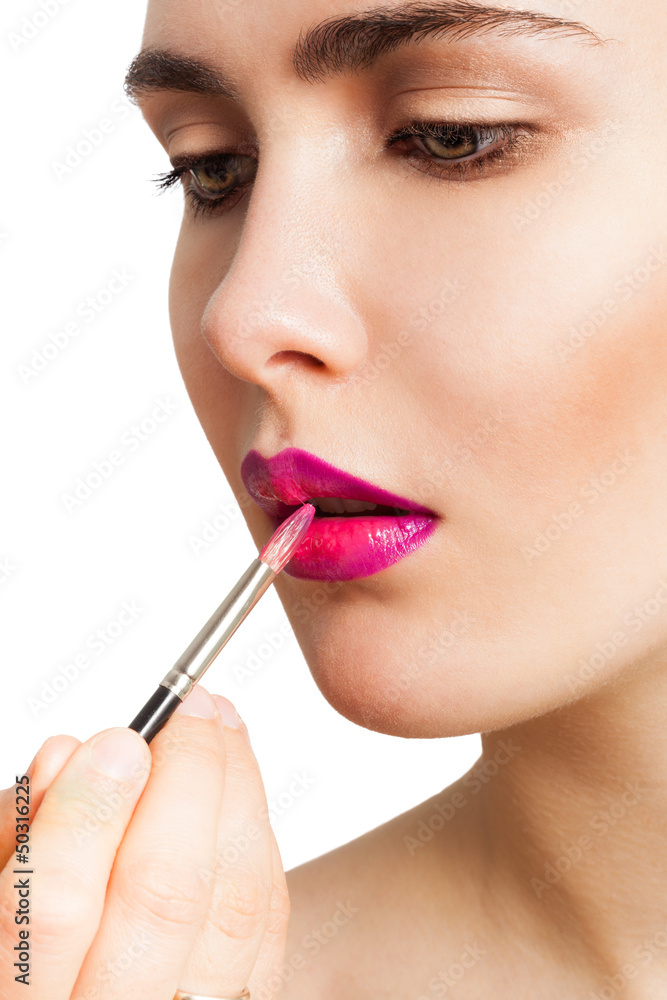 Applying lipstick brush