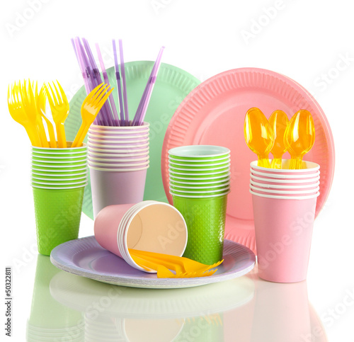 Multicolored plastic tableware isolated on white